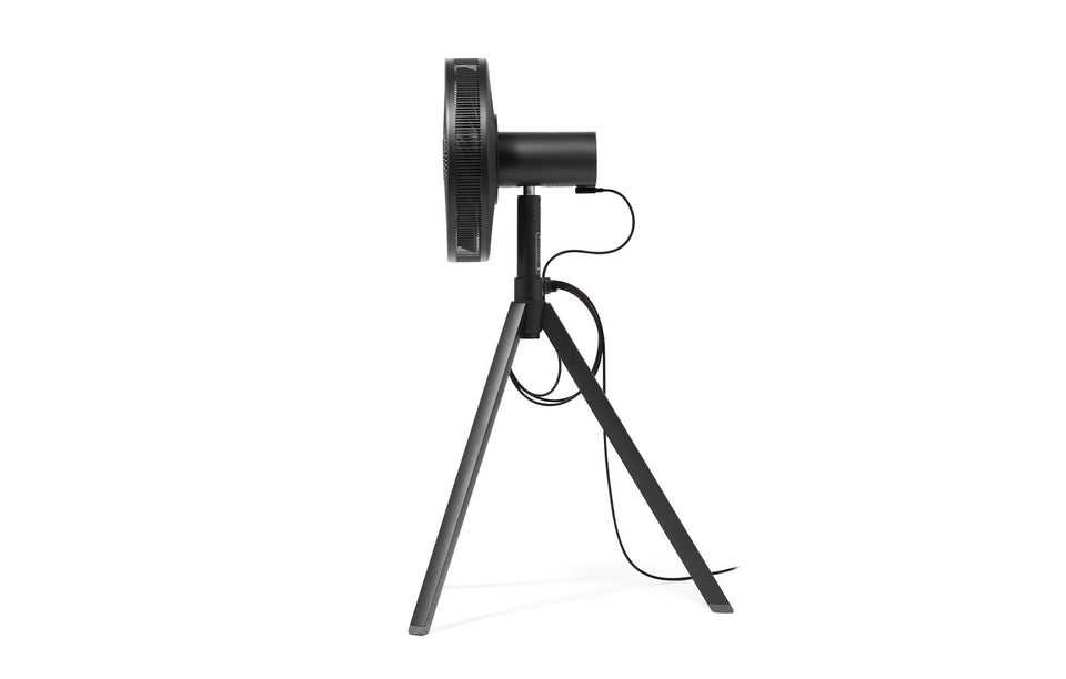 Black NatureWind Studio fan from the side, showing the tripod base