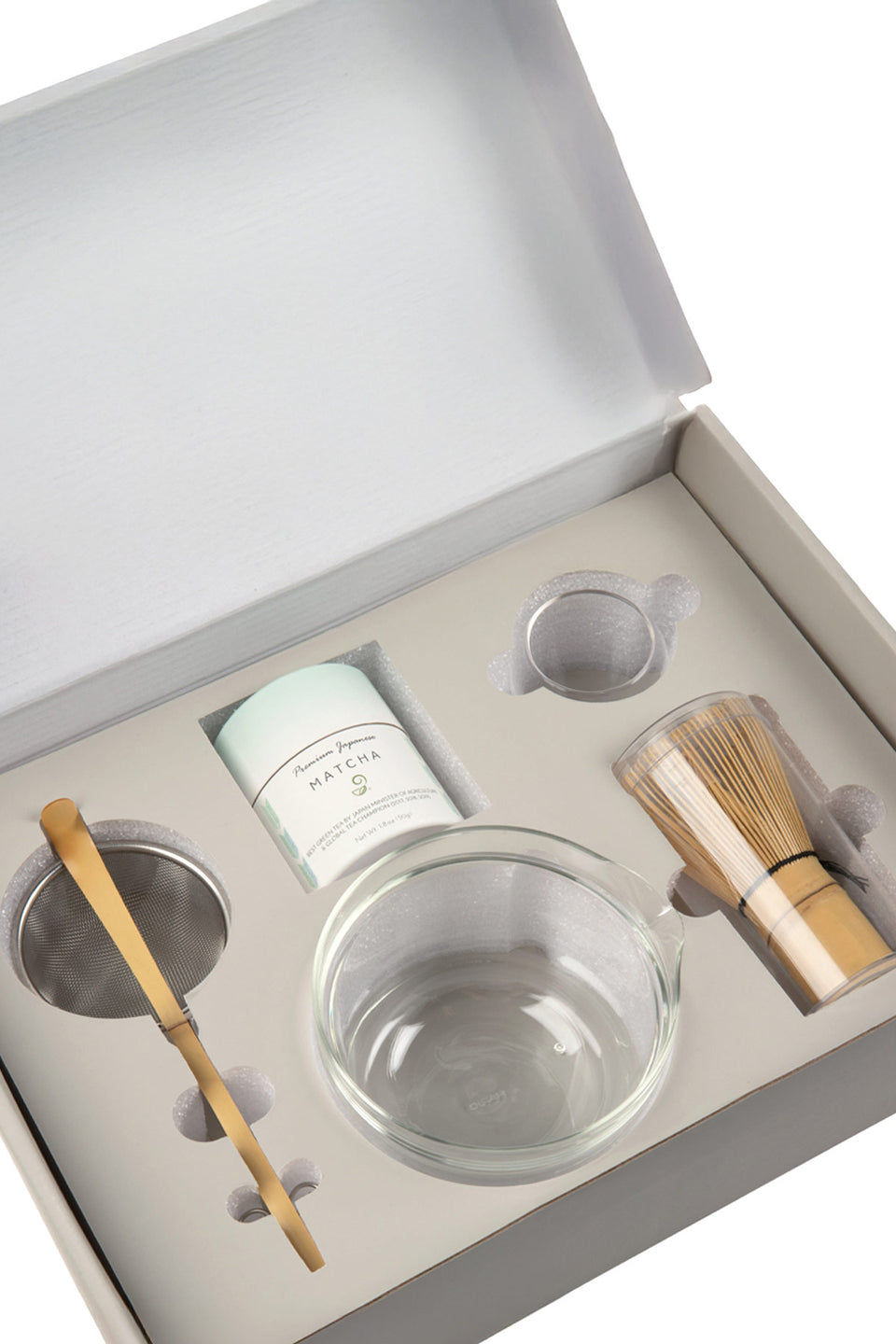 Tea-making set with glass bowl, whisk, and other tools in a box