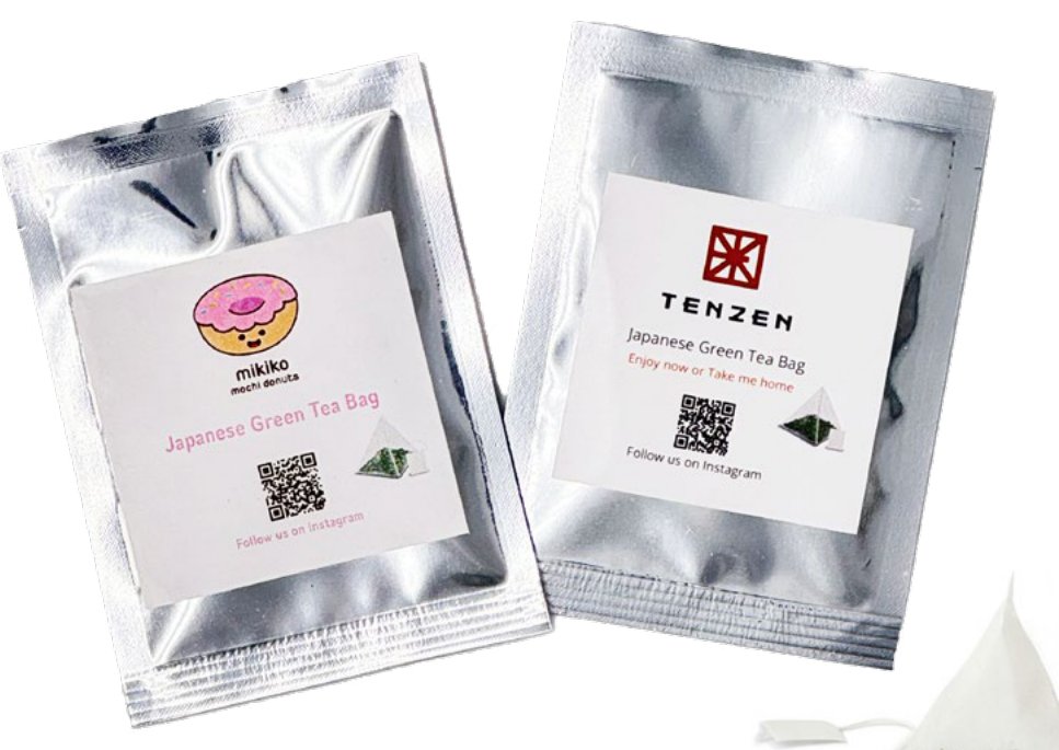Custom-label Japanese green tea bags with a company logo and QR code